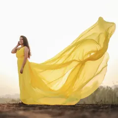 Capture that golden hour magic with this bright yellow tail gown. The long, airy tail is designed to catch the light and wind, creating an effortlessly beautiful and ethereal look for your pre-wedding shoot.
