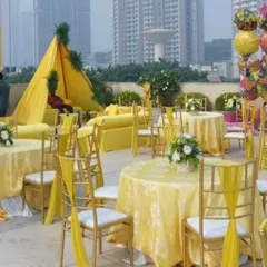 This view shows the guest seating area for the Haldi function. I used yellow table linens and chair ties to maintain the vibrant color scheme throughout the entire venue.