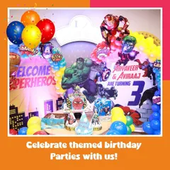 A full view of our action-packed superhero theme. The backdrop features Hulk and Iron Man, with a cake table ready for the celebration.