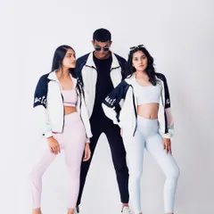 Another pose from the 90s-themed e-commerce shoot, showing how the jackets can be styled for a cool, coordinated look.
