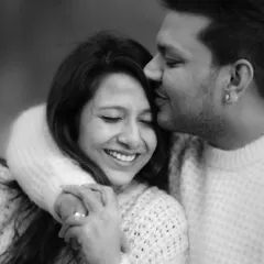 Black and white photography has a way of stripping away distractions and focusing on pure emotion. This tender kiss on the forehead from Piyush to Sayantani is a perfect example of timeless, heartfelt romance.