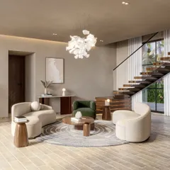 Another view of the Siroi Lilly living area, showing its relationship to the floating staircase. The design uses curved furniture and a circular rug to create a soft, defined social hub within the larger open space.