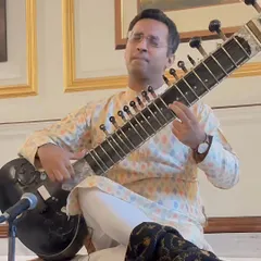 Lost in the music during a house concert. I tailor the selection of raags and compositions to suit the mood and preferences of the host and guests.