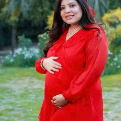 A close-up portrait showcasing that beautiful pregnancy glow. The soft, natural light of the outdoors and the simple, happy expression make this a timeless keepsake.