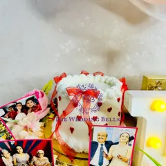 A close-up of our grand birthday hamper. We included a mini cake and personalized photo cutouts to make the celebration feel extra special and heartfelt.