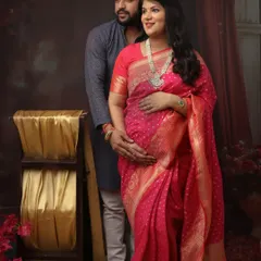 The vibrant pink of this Banarasi saree is simply breathtaking. I posed this couple to create a classic portrait that feels both traditional and full of love and anticipation.