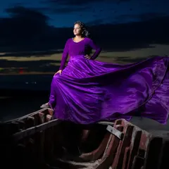The same stunning shot, emphasizing how the gown's fabric and color create a powerful visual, perfect for couples wanting artistic and memorable photos.
