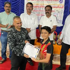 Atharva receiving his award after winning a double crown (U-13 and U-15) at the state championship in Belgaum. His hard work is paying off with consistent results.
