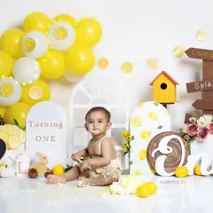 The aftermath of a successful cake smash! We believe the mess is part of the memory, capturing pure toddler joy.