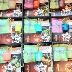 A collection of our employee recognition gift boxes ready to be sent out. Each box is filled with premium chocolates and a scented candle to make team members feel valued.