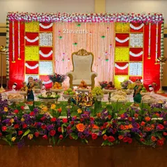 A classic Seemantha decor with a bright and colorful floral backdrop. The setup is perfect for capturing beautiful photos of your special day.