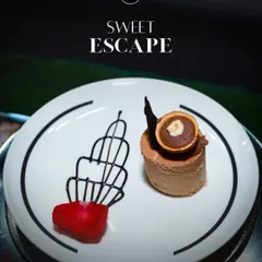 My Ferrero Rocher plated dessert is pure indulgence. A rich chocolate and hazelnut mousse is crafted to impress, garnished with chocolate art and a rose petal for a touch of elegance.