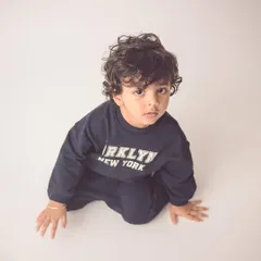 This little guy looks like he's straight out of a magazine. A simple, clean background is perfect for creating modern, ad-style portraits.
