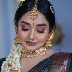 A detailed close-up of the airbrush makeup. Notice the smooth texture of the skin and the radiant finish, which is a signature of a good airbrush application.