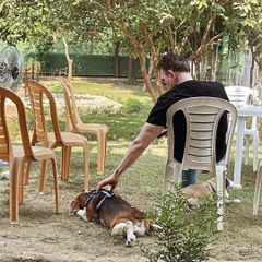 A day at the farm can also be a day of total relaxation. This guest and his beagle are enjoying a quiet moment together in the shade. It’s a therapeutic experience for both pets and their parents.