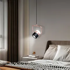 This adjustable spotlight pendant is perfect as a bedside reading light. You can direct the light exactly where you need it. The rose gold and black finish is very modern and stylish.
