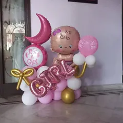 I create sweet and memorable balloon arrangements for baby announcements. This "It's a Girl" bouquet features a baby-shaped foil balloon, a crescent moon, and custom lettering in a pink, white, and gold color scheme.