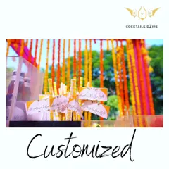 Custom bar stationery adds a polished and personal touch. These drink stirrers feature the couple's hashtag, tying the bar experience into the overall wedding theme.