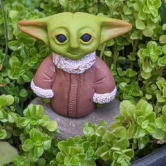 May the force be with you. This Baby Yoda is handcrafted from polymer clay and makes the perfect desk buddy for any Star Wars fan.