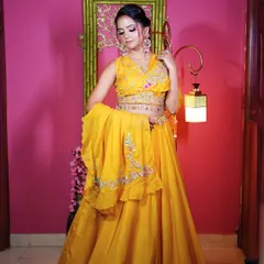 A full-length view of the yellow Haldi lehenga with a stylish belted dupatta, perfect for a fun and festive look.