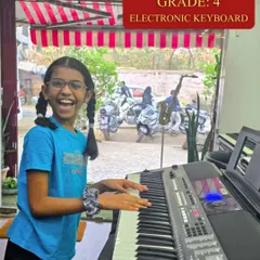 The joy of making music is clear on Tara's face as she rehearses for her Grade 4 Electronic Keyboard exam. Our studio is equipped with a range of instruments for students to practice on.
