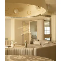 We see dining tables as centerpieces for stories and meals. This piece features a custom marble inlay top with sinuous patterns inspired by illustrator Jane Foster, crafted from Crema Marfil and Federal Beige marble. It’s paired with a fluted banquette, creating an intimate and artistic dining nook.