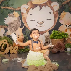 The biggest, happiest, messiest smile. A cake smash session is all about capturing the pure joy of being one, and this little lion king is loving every moment.