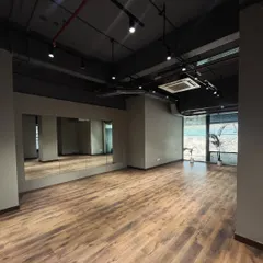 A closer look at the main mirrored wall. These mirrors are a non-negotiable for any serious dance rehearsal or fitness class, allowing instructors and participants to see and correct their movements with ease.