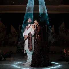A modern, dramatic portrait using creative stage lighting. We love playing with light to create unique and memorable shots that give our couples a superstar feel.