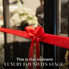 This is the moment. The simple, elegant red ribbon stands ready, a symbol of the beginning of a new chapter for Maybach. The blurred background with our floral decor hints at the luxurious experience waiting to be unveiled inside.