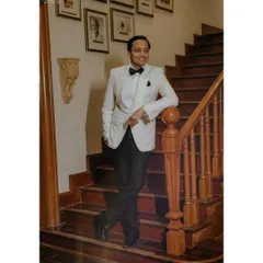 A dapper portrait of the groom in his tuxedo, looking relaxed and happy during the Sangeet. We make sure the groom gets his share of stylish solo shots.