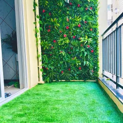 A complete balcony makeover in a Bangalore apartment. We installed our soft, durable turf on the floor and created a custom vertical garden wall with pops of red, turning a standard balcony into a private, vibrant oasis.