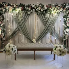 I also create soft and elegant themes for ring ceremonies or intimate weddings. This setup uses beautiful sage green drapes, classic white and pink flowers, and a comfortable tufted bench for a timeless and romantic look.