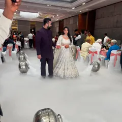 Capturing the grand entrance from another perspective. I coordinate with photographers and videographers to ensure these key moments are captured perfectly.