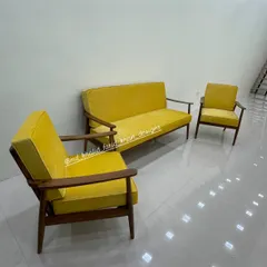 The complete three-piece yellow sofa set, ready to bring a pop of color and style to a client's living room.