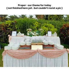We never repeat a setup. This elegant outdoor buffet station, with its soft pink and white draping, was custom-designed to match the wedding's theme, ensuring a unique look.