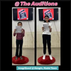 More aspiring actors auditioning for "The Dream Chasers". This image shows two girls focused on their scripts, demonstrating the interest and enthusiasm our theatre programs generate.