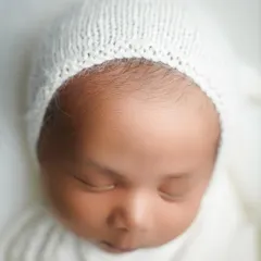 The delicate fuzz on a newborn's forehead, a detail that vanishes in just a few weeks. My newborn detail shots are dedicated to capturing these fleeting features.