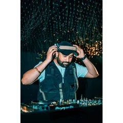 A clear, professional shot of me getting ready for a set. This moment of focus is crucial before the music starts and the party begins.