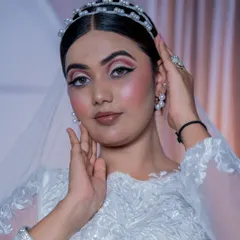 This is my take on the perfect Christian bridal look: soft, romantic, and absolutely timeless. The makeup is designed to look fresh and radiant, complementing the white gown and veil, with a clean updo and a delicate pearl tiara to complete the angelic look.