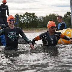 A moment of camaraderie in the chilly waters of Estonia. Even in a race, you're surrounded by people sharing the same crazy experience.