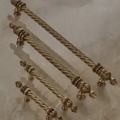 The Volga Collection also includes these exquisitely detailed cabinet pulls. The twisted rope motif and ornate finials provide a touch of classic grandeur to cabinetry and furniture, available in various sizes for a cohesive look.