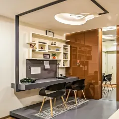 We used a raised platform to create a distinct and elevated study zone for two. This design choice visually separates the workspace from the rest of the room while adding a modern architectural element.