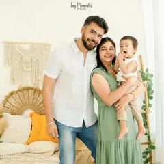 A burst of laughter makes for the best photograph. This candid moment captures the pure joy of being together as a family in a relaxed and beautiful setting.