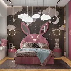 This adorable bunny-themed bedroom is perfect for a young child. We designed a custom pink bed with a light-up bunny-ear headboard, cloud-shaped pendant lights, and a cozy window seat for a playful and enchanting atmosphere.