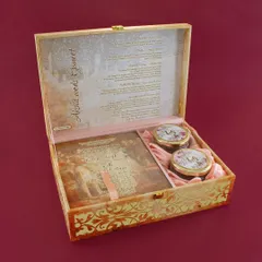A vintage-inspired wooden box invitation featuring a personalized story and photo of the couple. The box is lined with satin and has compartments for the card and two gift jars.
