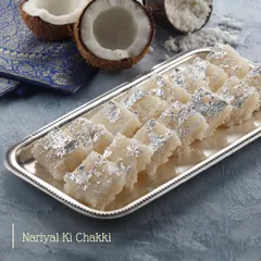Love at first bite. Our Nariyal Ki Chakki is a classic Indian sweet made with fresh coconut, sugar, and garnished with silver vark for a melt-in-your-mouth experience.
