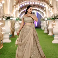 A full view of the champagne gold lehenga, showing how it catches the light beautifully. This is the perfect outfit to make a grand entrance.