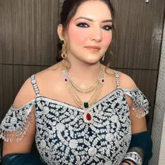 The full look, showing how the makeup complements the intricate details of the cold-shoulder gown.