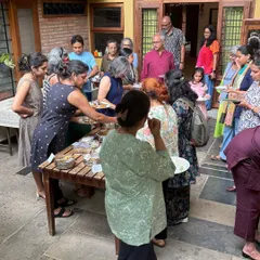 This is what a 'Koota' or gathering looks like. Our outdoor courtyard filled with people sharing food and laughter during a Local Food Club potluck. Community is at the center of everything we do, and nothing brings people together like good food and great conversation.